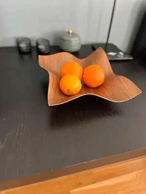 two oranges on a wooden plate on a table at Kvitfjell mountain in Strande