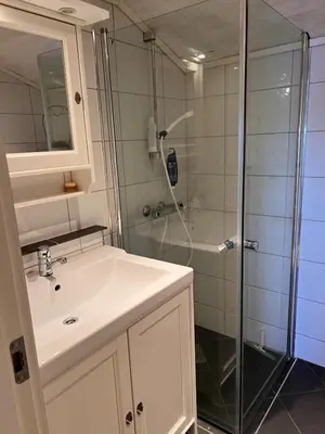a bathroom with a sink and a shower at En Perle ved Masfjorden in Masfjorden