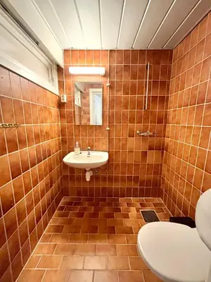 a bathroom with a sink and a mirror at Faleide Grandview in Stryn