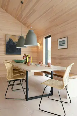 a dining room with a table and chairs at Modern Light Neo Cabin On Bjefell in Svene