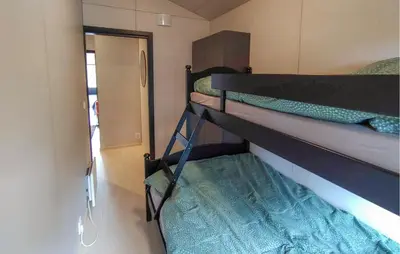 a couple of bunk beds in a small room at Amazing Apartment In Bjorli in Bjorli