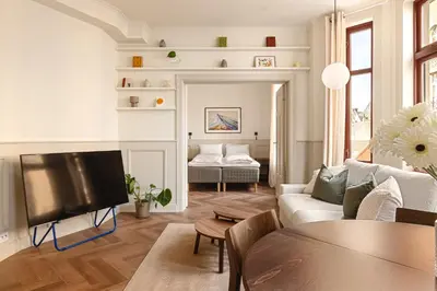 a living room with a couch and a tv at F7 l Architects Choice in Bergen