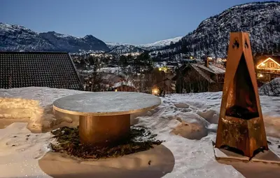 a table sitting on top of a snow covered mountain at Pet Friendly Home In Hovden I Setesdal in Hovden