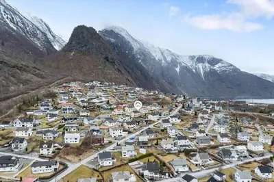 an aerial view of a village in the mountains at FjordNest Årdalstangen in Årdalstangen