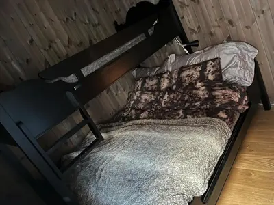 a bed in a room with a bunk bed with at Modern mountain apartmen Ski in and out in Trysil