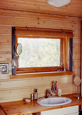 a bathroom sink with a mirror and a window at Cozy Cabin In Scenic Vøringsfoss in Garden