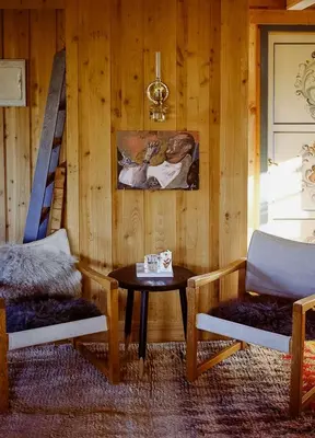 a room with a table and two chairs and a staircase at Cozy Cabin In Scenic Vøringsfoss in Garden