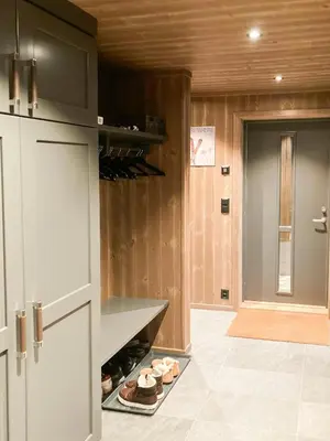 a kitchen with a counter with wine bottles at Family Cabin With A View Of Skeikampen in Svingvoll