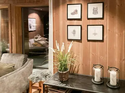 a living room with a table and a couch at Family Cabin With A View Of Skeikampen in Svingvoll