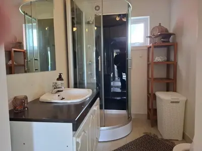 a bathroom with a sink and a shower at Apartment in the heart of Sunnmore in Vigra