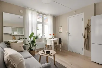 a living room with a couch and a table at Welcome to our home in the centre of Bergen! in Bergen