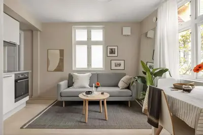 a living room with a couch and a table at Welcome to our home in the centre of Bergen! in Bergen