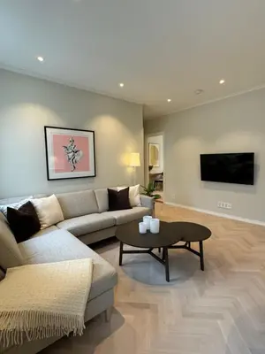 a living room with a couch and a table at MB25 Apartment in Bergen
