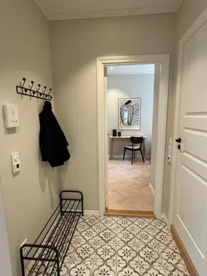 a hallway with a door leading into a room at MB25 Apartment in Bergen