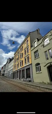 a row of buildings on the side of a street at MB25 Apartment in Bergen