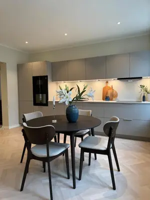 a kitchen and dining room with a table and chairs at MB25 Apartment in Bergen