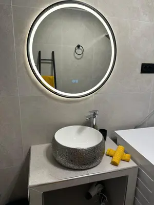 a bathroom with a sink and a mirror at Magnhilds Luxury Apartment in Otta