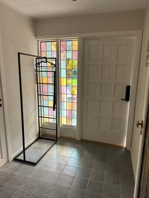 a room with a door with a stained glass window at Magnhilds Luxury Apartment in Otta