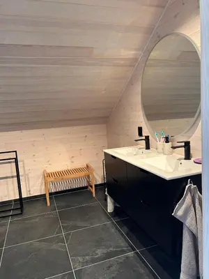 a bathroom with a sink and a mirror at Rinden cabin in Sogndal