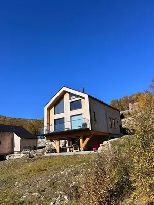 a house being built on top of a hill at Rinden cabin in Sogndal