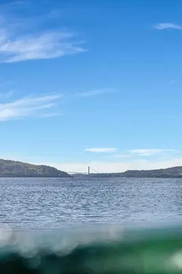a view of a bridge over a large body of water at Heimby - Seaside View Luxury - Free Parking in Bergen