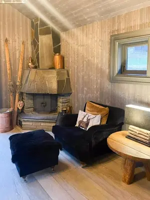a living room with a couch and a fireplace at Mountain Escape Near Gulsrud With Historical Charm in Eggedal