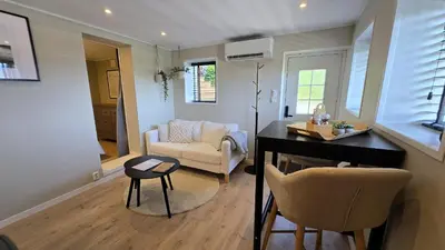a living room with a table and a couch at Morgensolen in Bergen