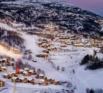 a small town in the snow on a mountain at Ski-in ski-out high standard cabin, 3 bedroom in Oppdal