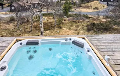 a hot tub on top of a house at Stunning Home In Etnedal With Sauna in Etnedal