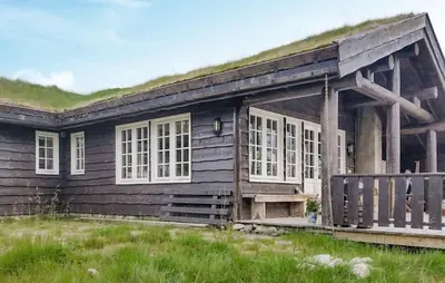 a log cabin with a grass roof at Stunning Home In Etnedal With Sauna in Etnedal