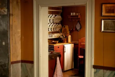 a kitchen with a sink and a stove top oven at Per Amundsagården in Røros