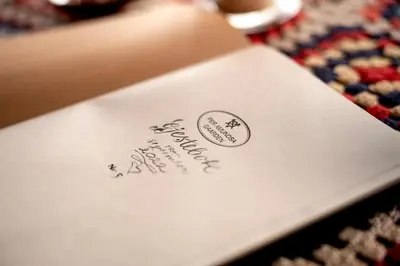 a piece of paper sitting on top of a table at Per Amundsagården in Røros