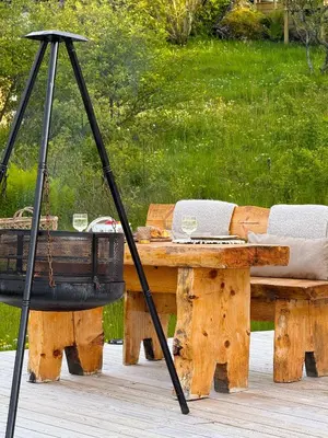 a wooden table with a basket on top of it at Idyllisk overnatting i dome ved sandstrand in Langenes