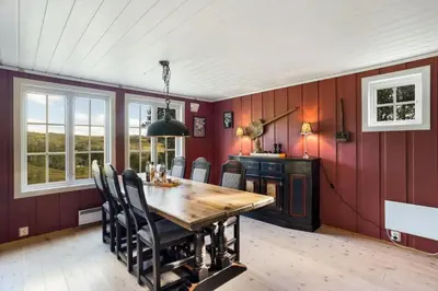 a dining room with a wooden table and chairs at Mountain Cabin With Cross-Country Trails In Rauland in Rauland