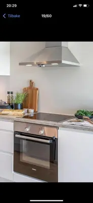 a kitchen with a stainless steel stove top oven at Rom i nyere rekkehus nord i Haugesund in Haugesund