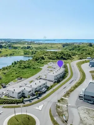 an aerial view of a building with a road at Rom i nyere rekkehus nord i Haugesund in Haugesund