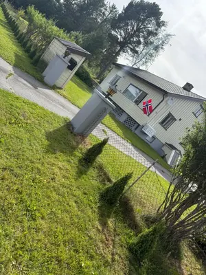 a house with a fence in front of it at A comfy House in Hol