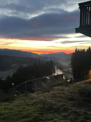 a view of the sunset from a hill at Apartment with a view at Bavallen Tråstølen Voss in Vossevangen