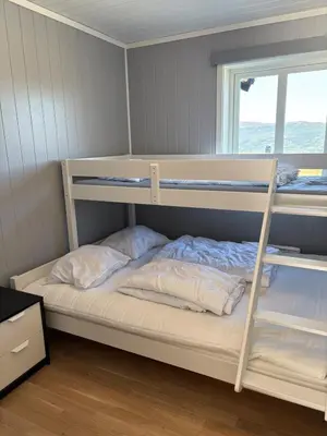 a bedroom with two bunk beds and a window at Modern apartment in Voss in Vossevangen