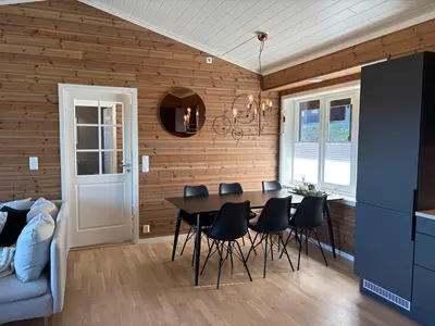 a dining room with a table and chairs at Modern apartment in Voss in Vossevangen