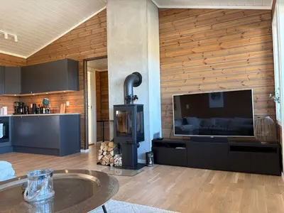 a living room with a large flat screen tv at Modern apartment in Voss in Vossevangen