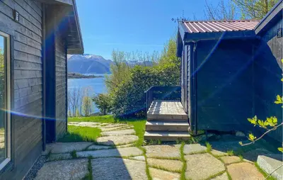a stairway leading to a building with a view of a lake at Knausen in Ørsta