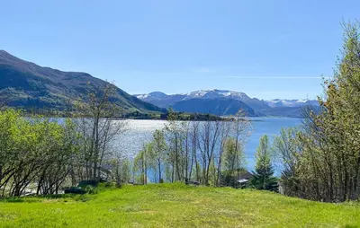 a view of a lake with mountains in the background at Knausen in Ørsta