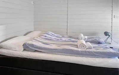 a bed with towels on it in a room at 2 Bedroom Lovely Home In Ørsta in Ørsta