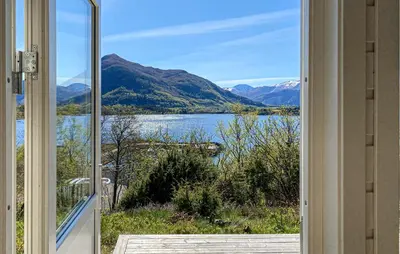a view of a lake from a window at 2 Bedroom Gorgeous Home In Ørsta in Ørsta