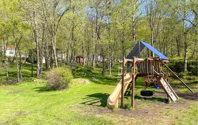 a playground in a park with a slide at 2 Bedroom Gorgeous Home In Ørsta in Ørsta
