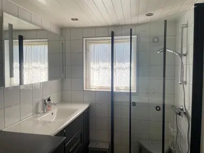 a bathroom with a sink and a shower at Log Cabin With Mountain View in Beitostøl