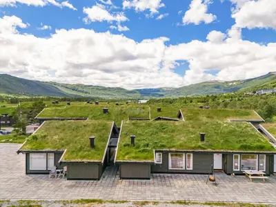 an image of a house with a green roof at Beautiful City Cottage at Geilotunet in Hol