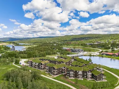 an aerial view of an apartment complex with grass roofs at Beautiful City Cottage at Geilotunet in Hol