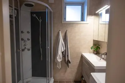 a bathroom with a shower and a sink at Big apartment in central Aalesund in Ålesund